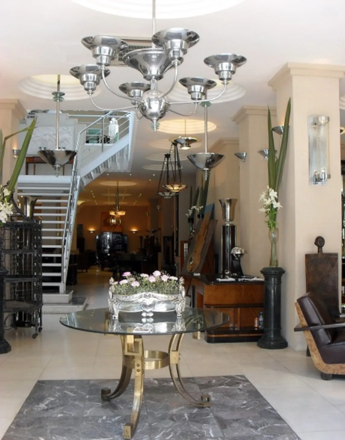 Antique dining table with artistic decoration, suitable for four people in an elegant setting.