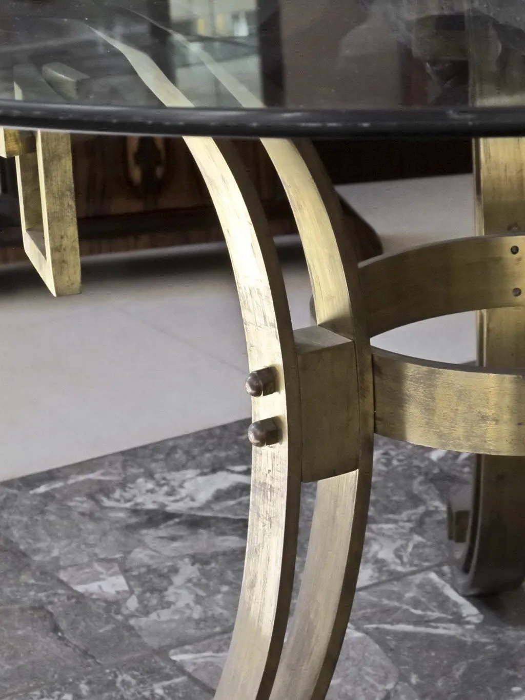 Antique dining table for 4 people with elegant metal structure.