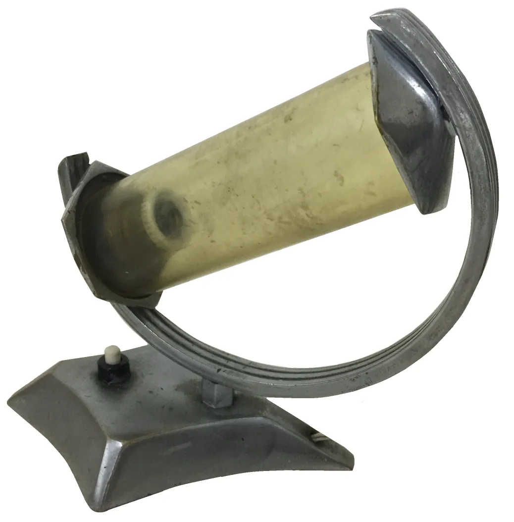 Lampada da tavolo antica con cilindro trasparente e design unico.