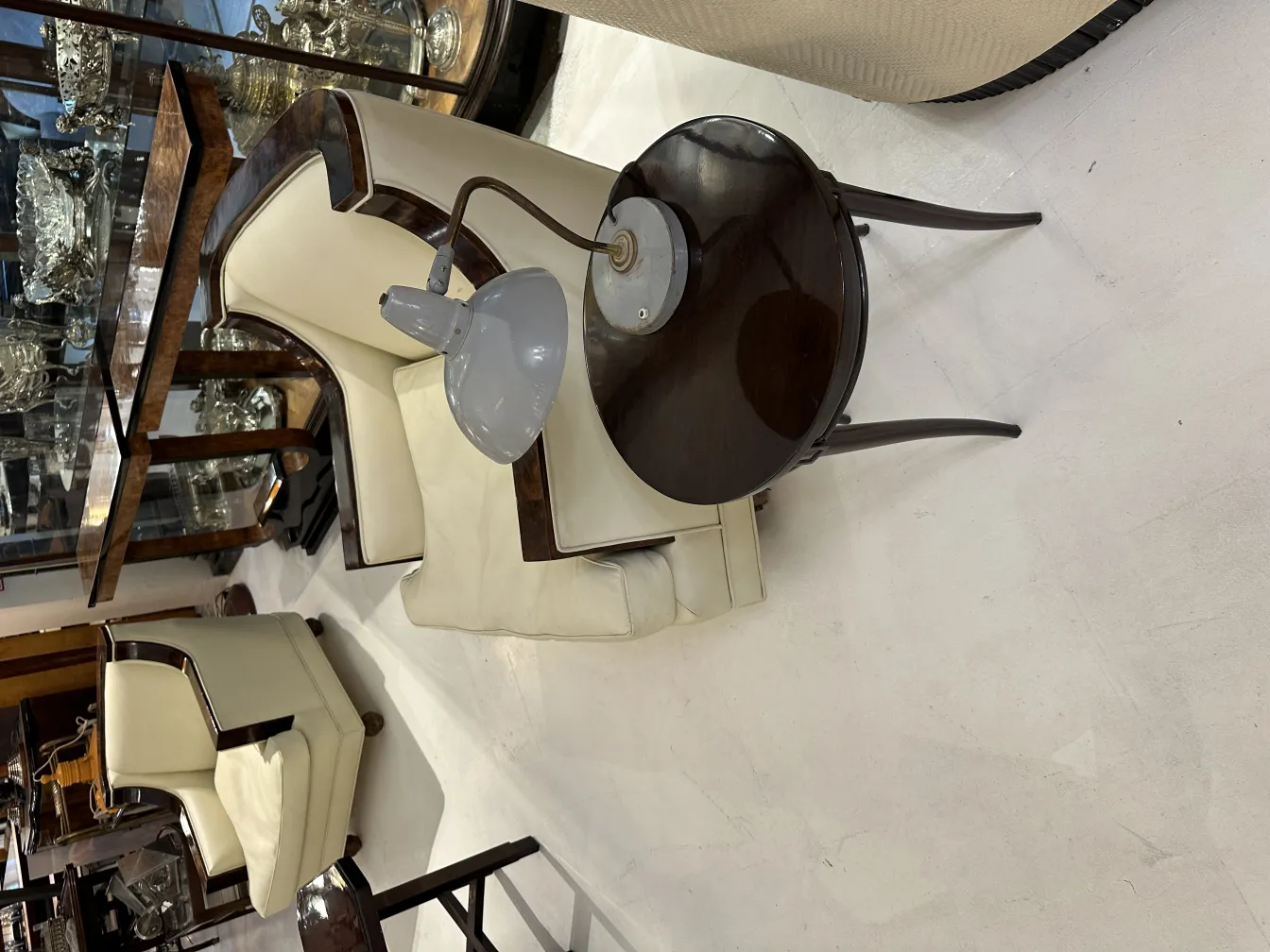 Antique table lamp in classic shape placed in a cozy setting.