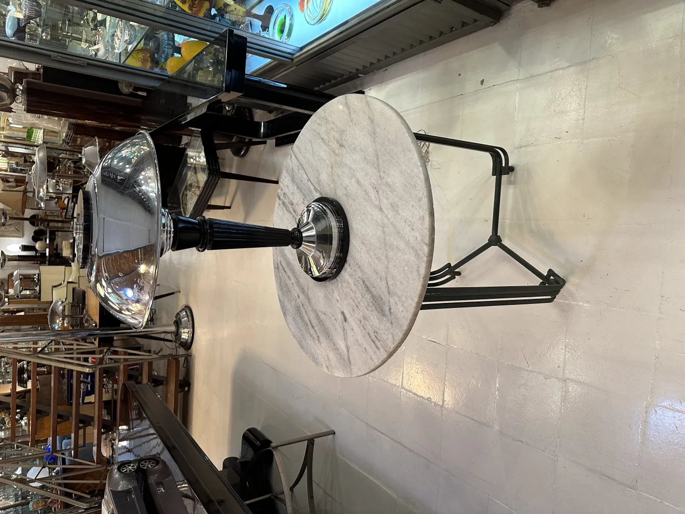 Antique table lamp with black base and elegant design, vintage setting