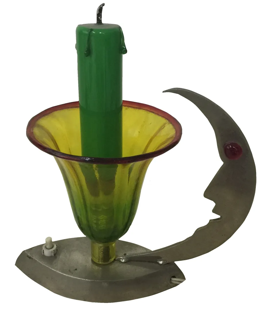 antique table lamp with green candle and metallic base, colorful setting