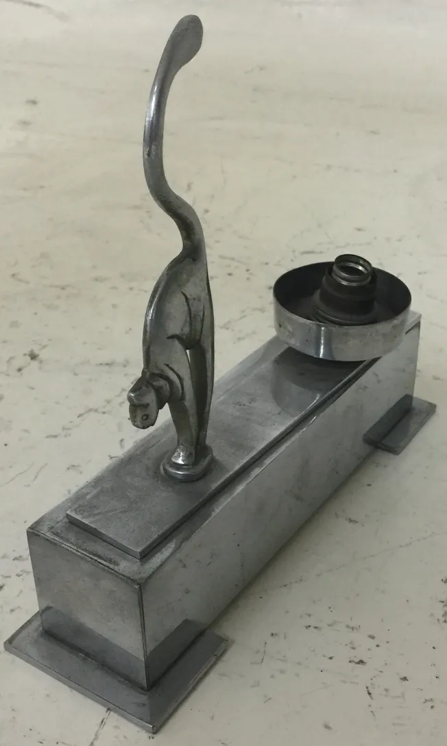 Antique table lamp featuring a cat design, ideal for decoration.