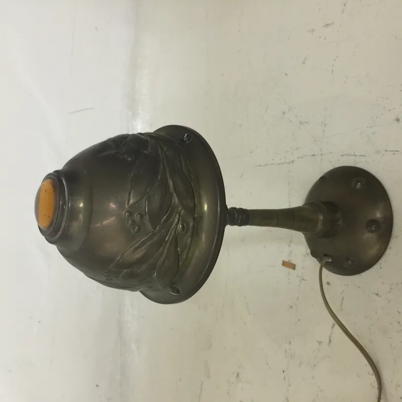 antique table lamp with decorative shade details and white background