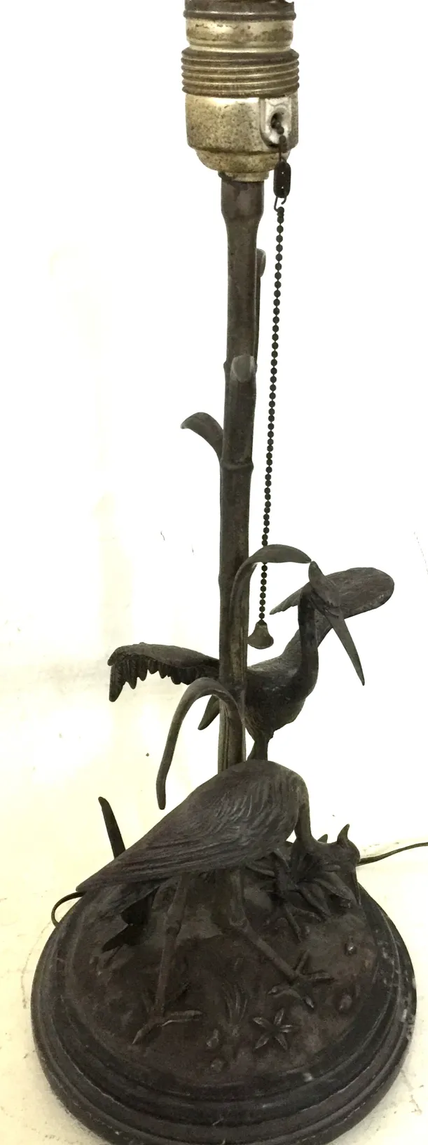 antique table lamp featuring birds as a base in a classic setting