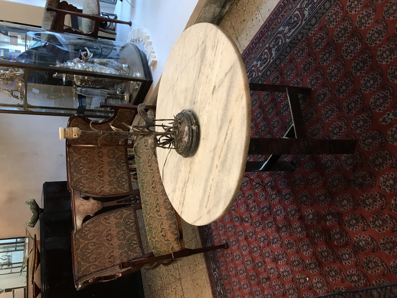 Antique table lamp with a decorative base and soft light