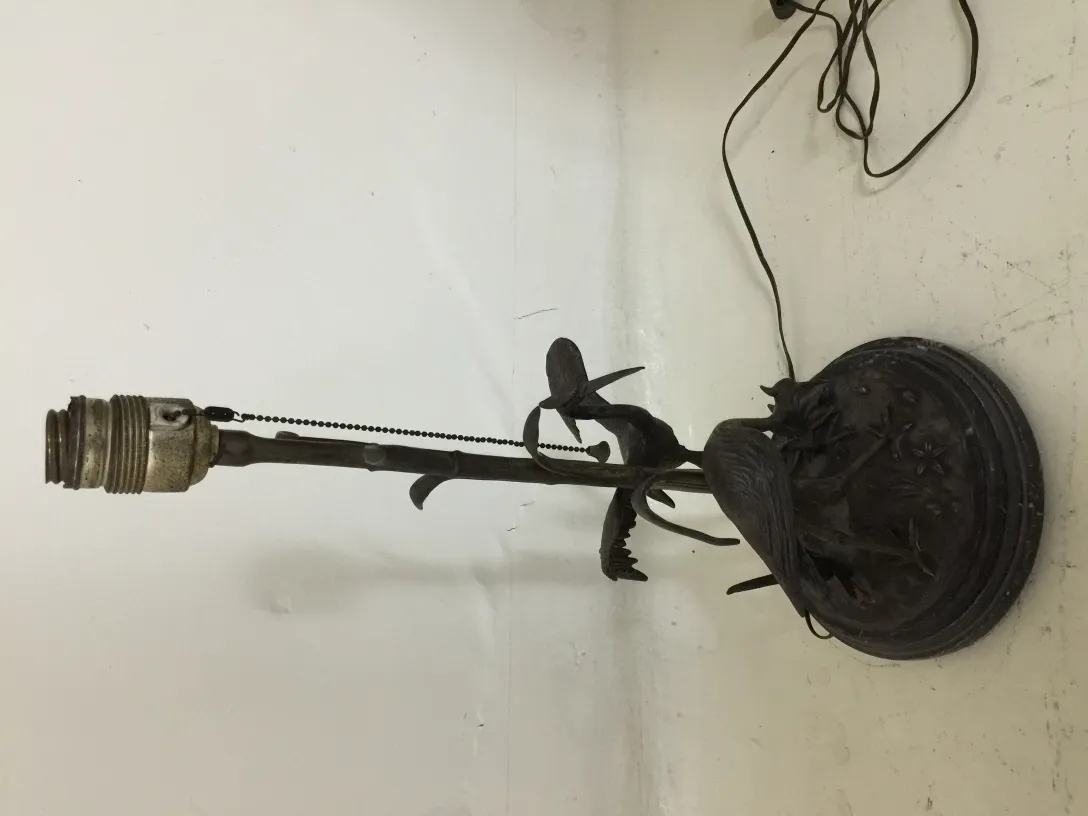 antique table lamp with decorative base in plant shape