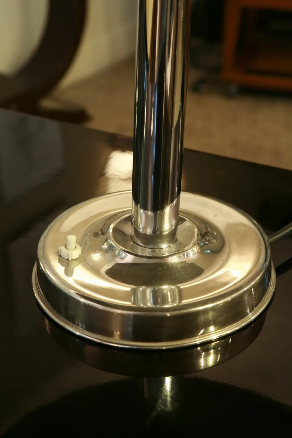 Base of an antique table lamp with a shiny finish.