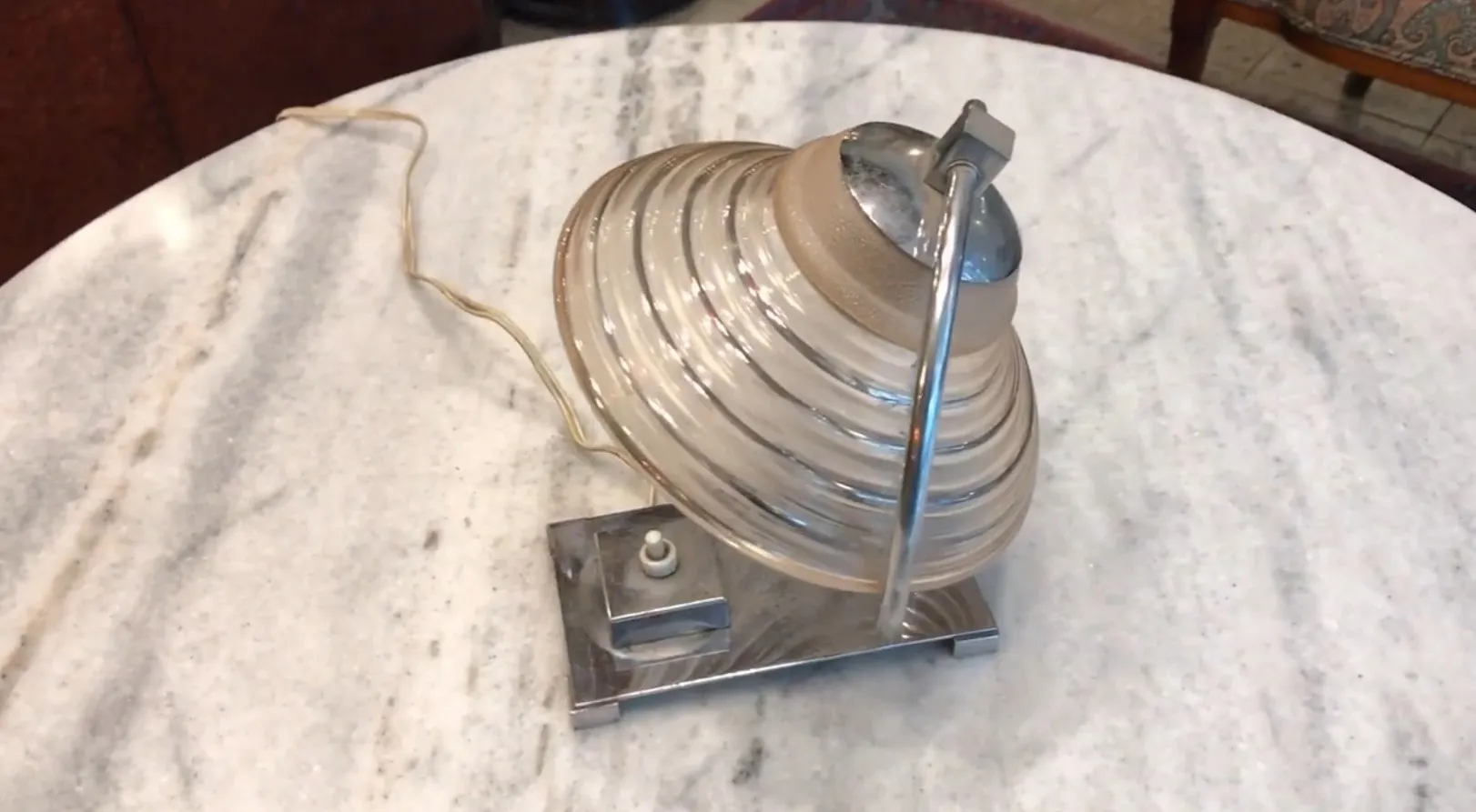 antique table lamp with round shape and metal base, cozy environment