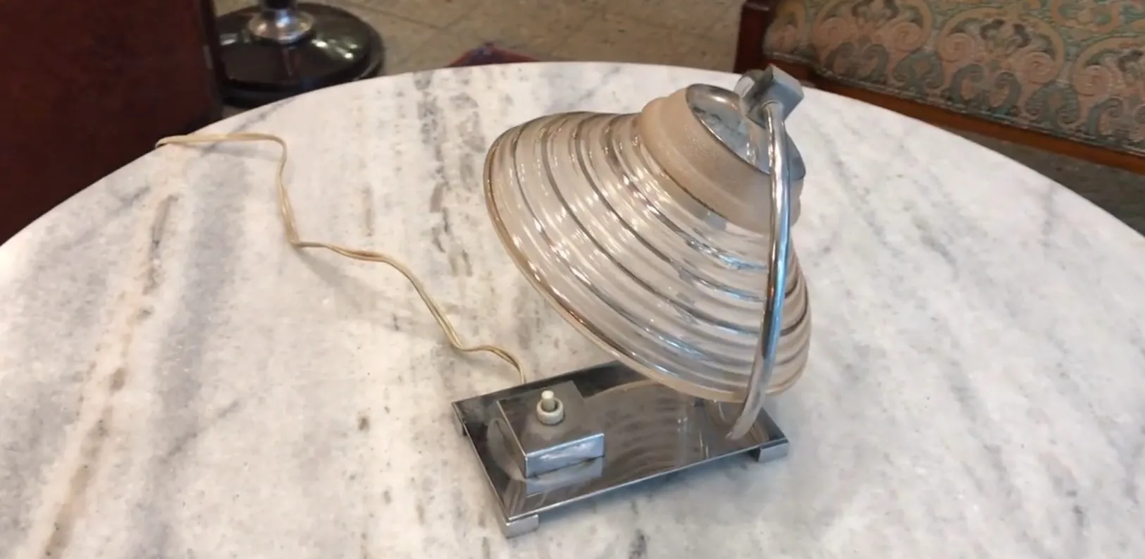 Antique table lamp with a distinctive and elegant design, perfect for any room.