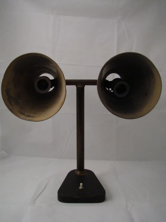 antique table lamp with two shades in bronze tone in neutral setting