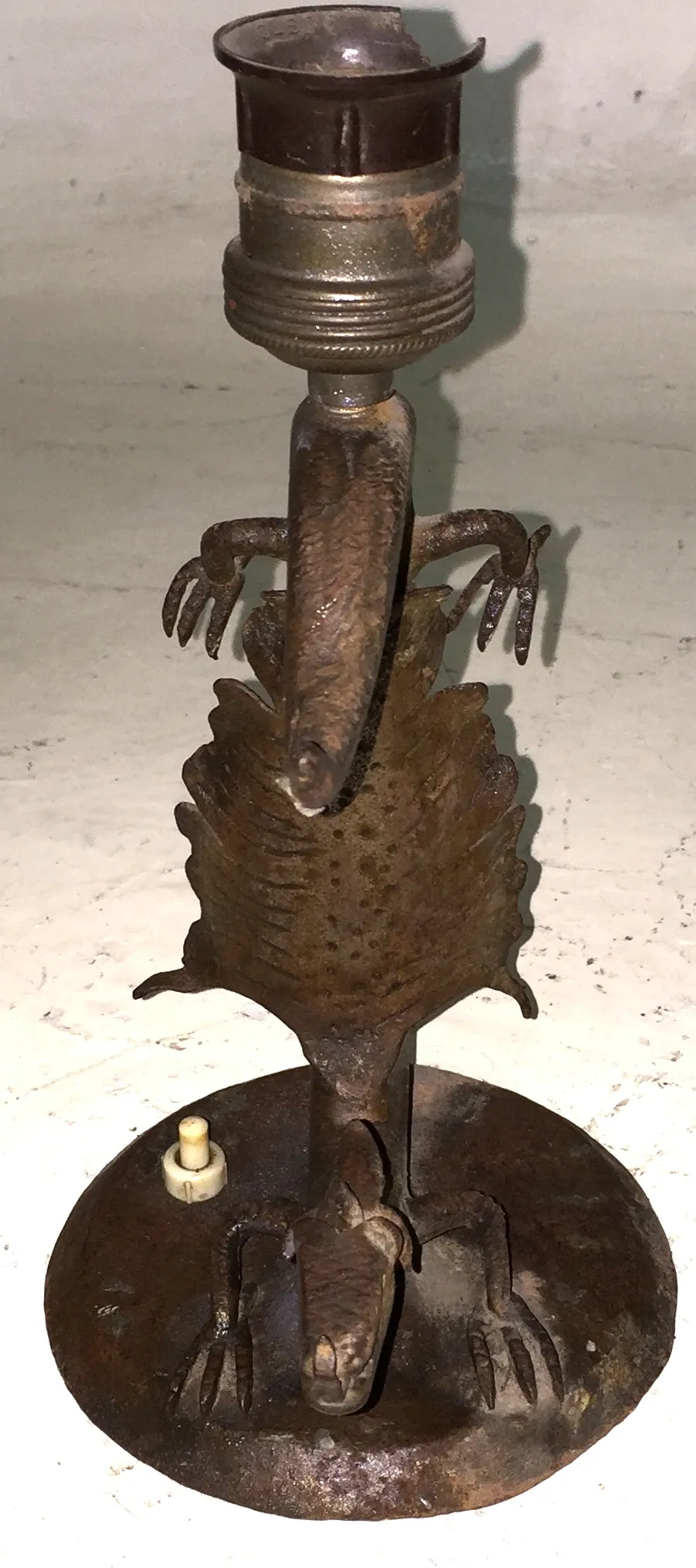 antique table lamp shaped like a reptile, decorative environment