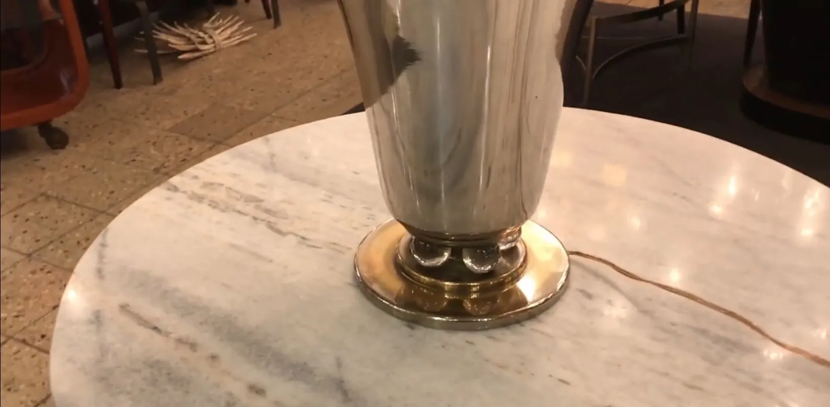 antique table lamp shining on a clear surface