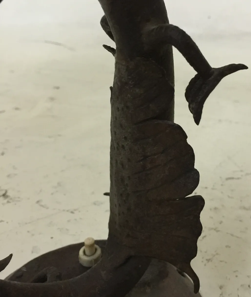 antique table lamp with visible details on its base and structure