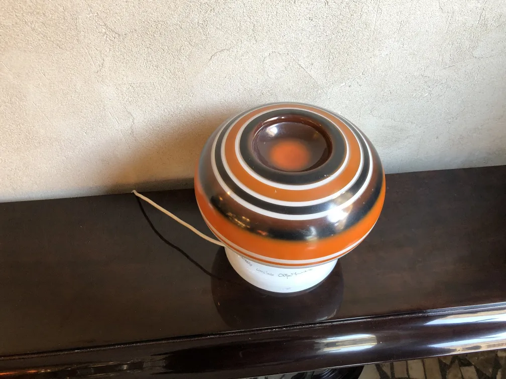 antique table lamp with spherical shape and vibrant colors in a cozy environment