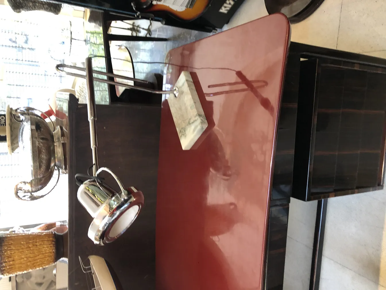 Antique table lamp with marble base in a decorative setting.