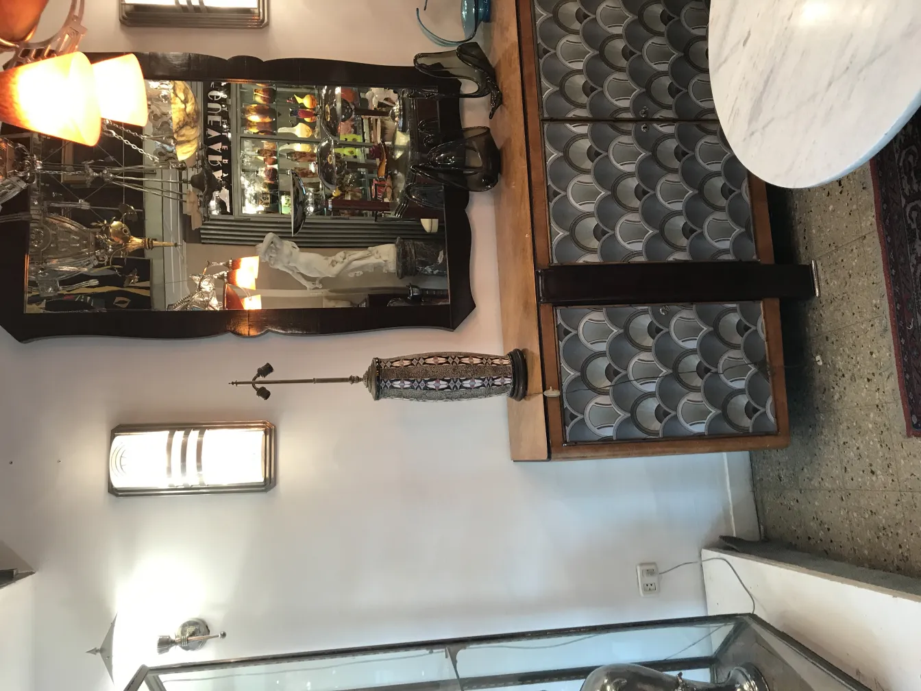 Antique table lamp with decorative design in a classic setting with vintage furniture.