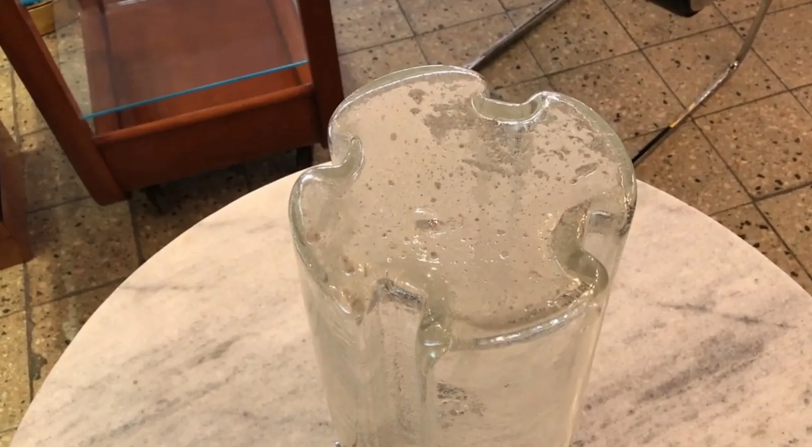 antique table lamp on a marble table with a curious design