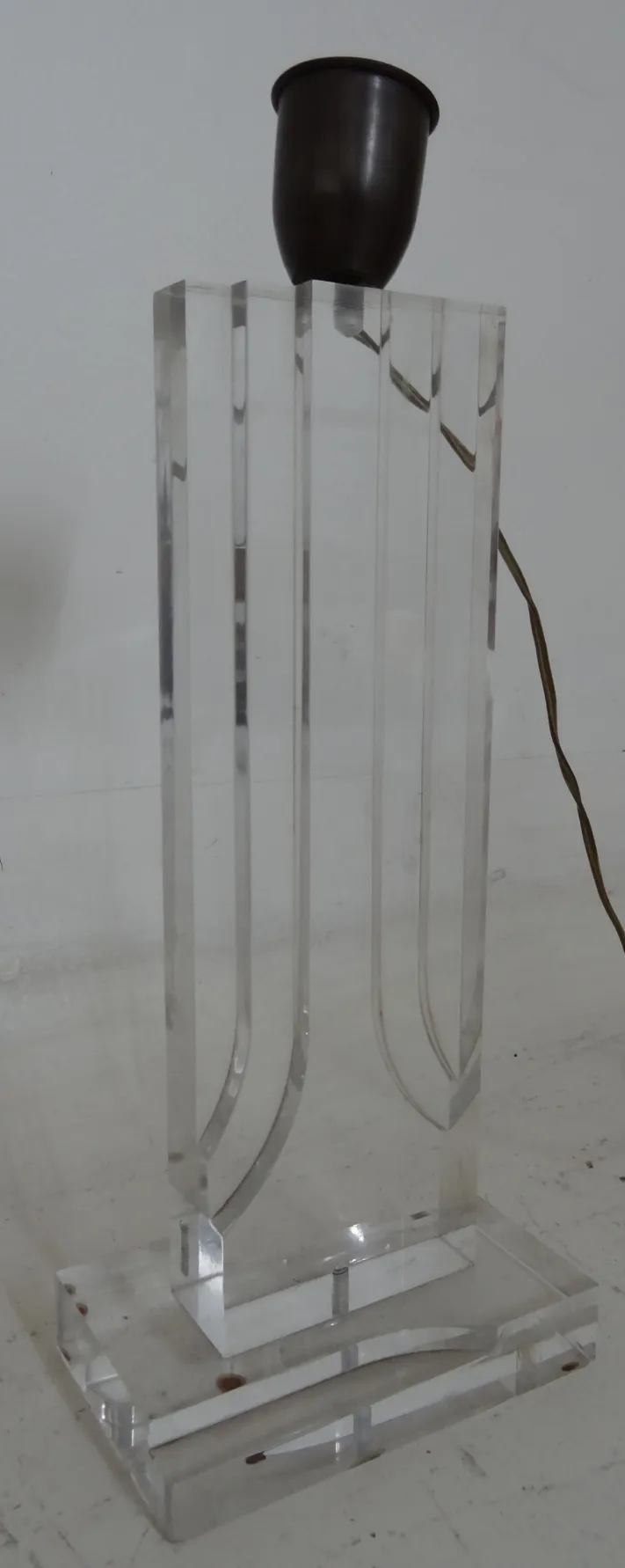 antique table lamp with transparent base and visible wire