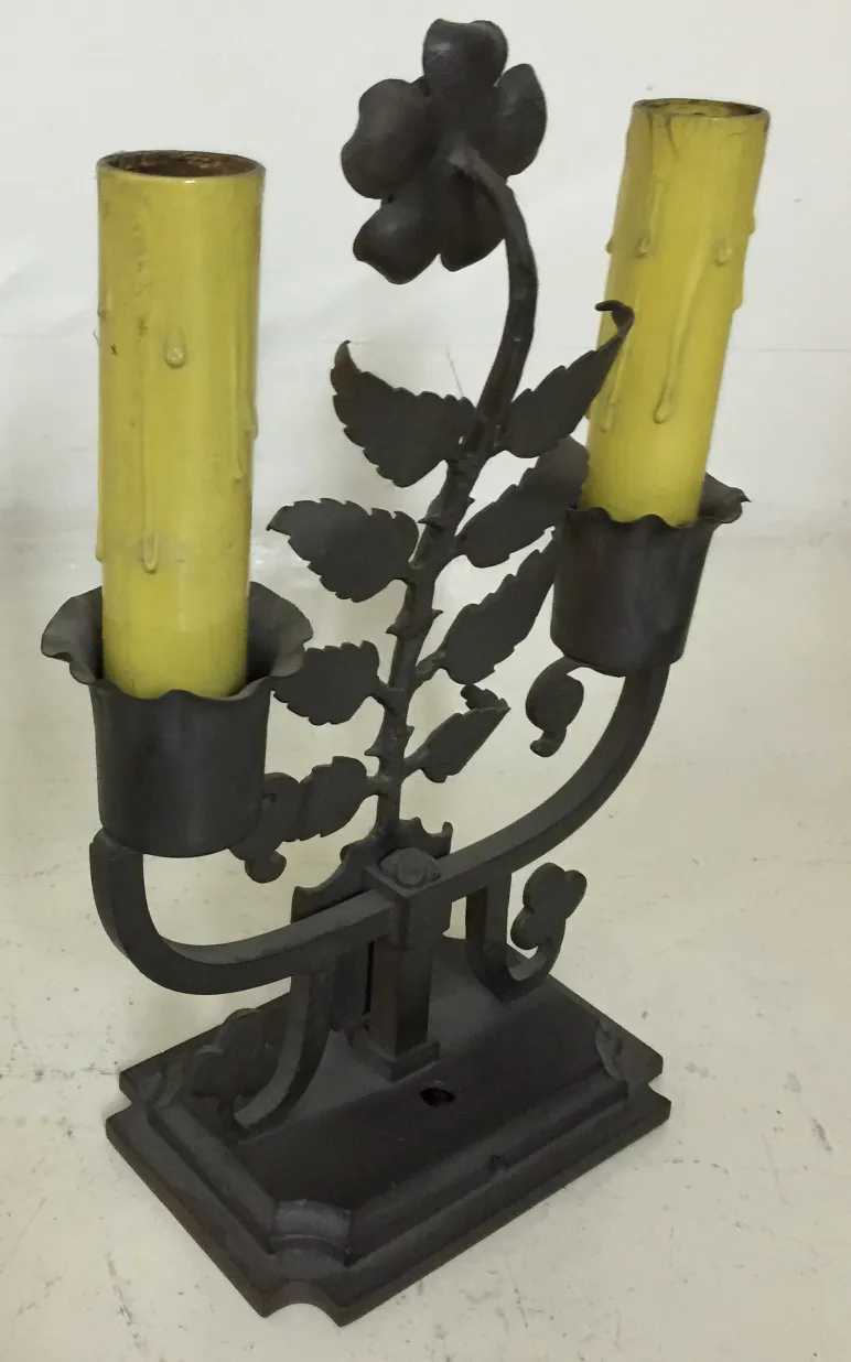 Antique table lamp with flower design and yellow colors.