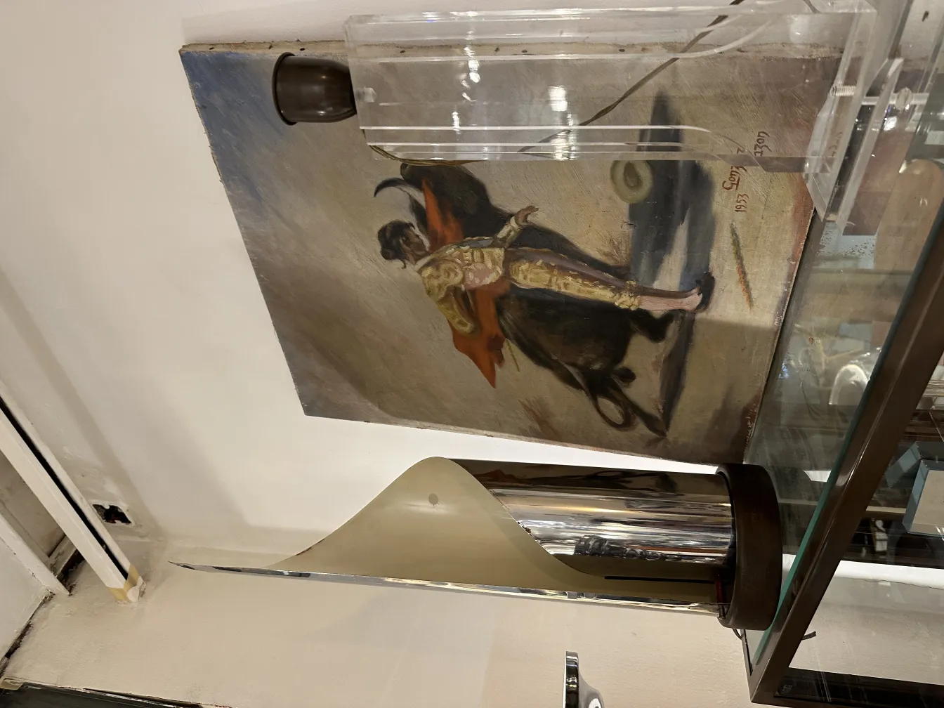 antique table lamp with contemporary design, surrounded by art