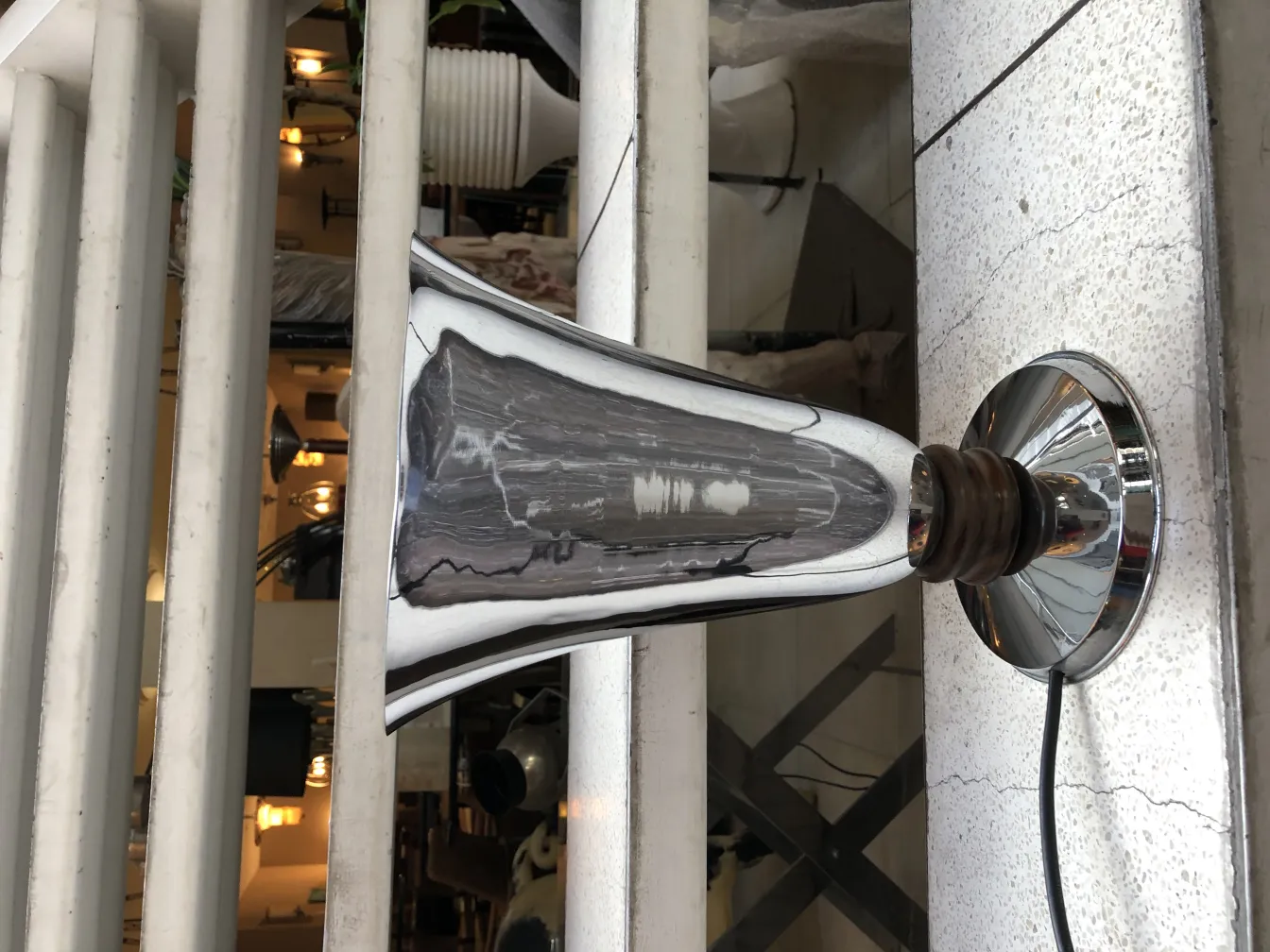 antique table lamp with a shiny finish, standing out in an elegant setting