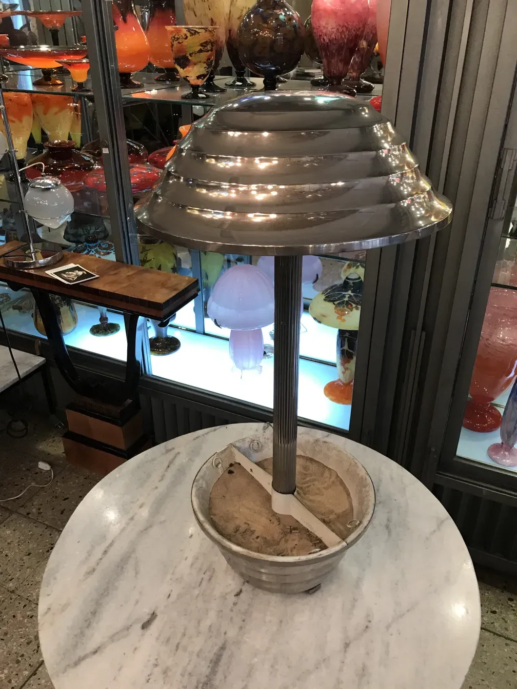 Antique table lamp with a distinctive design and decorative base.