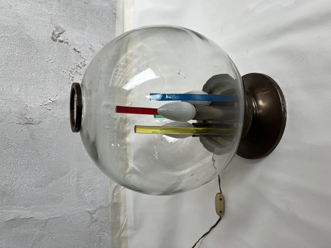 Antique table lamp featuring a colorful design on the base