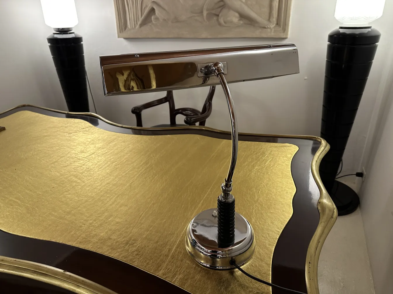 antique table lamp with elegant base and modern shade in office