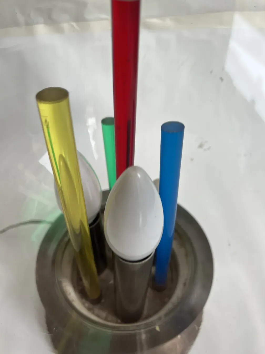 antique table lamp with colorful tubes in a modern holder