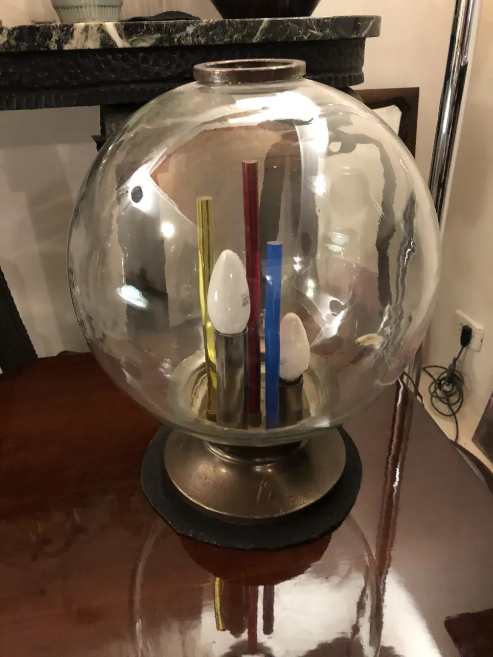antique table lamp with circular base and bright colors
