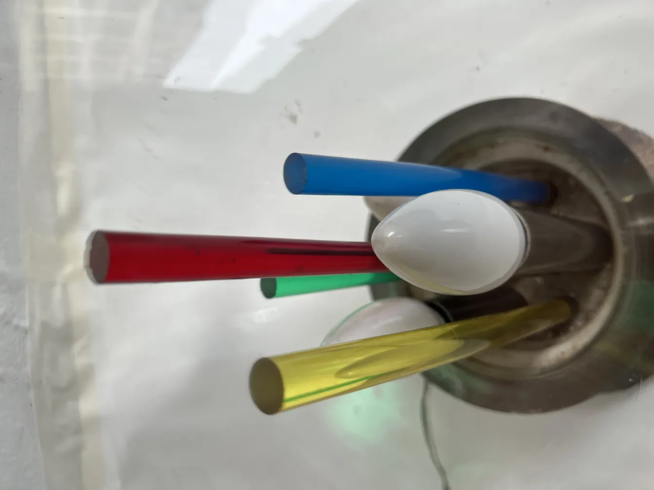 antique table lamp with various colored bars at the base