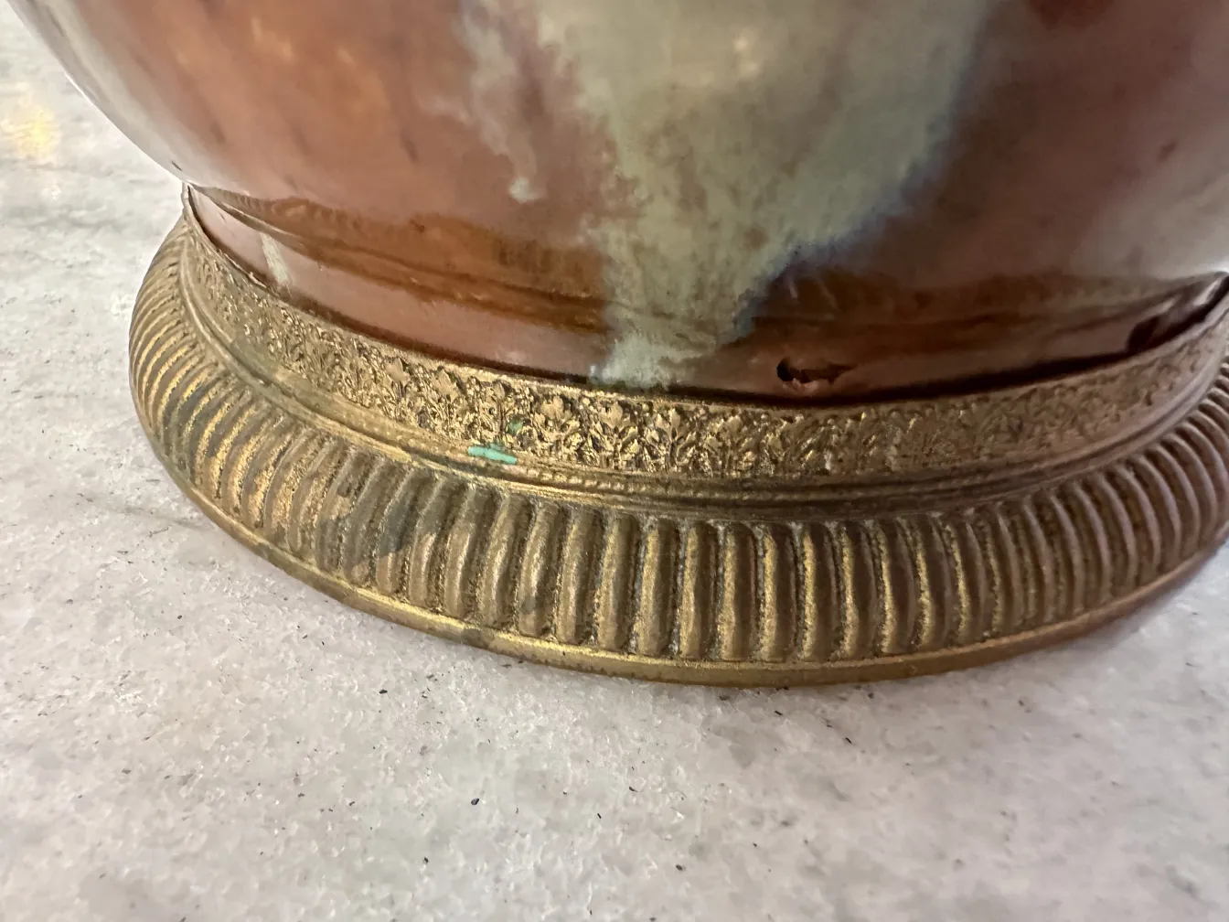 decorative base of an antique table lamp, gold details