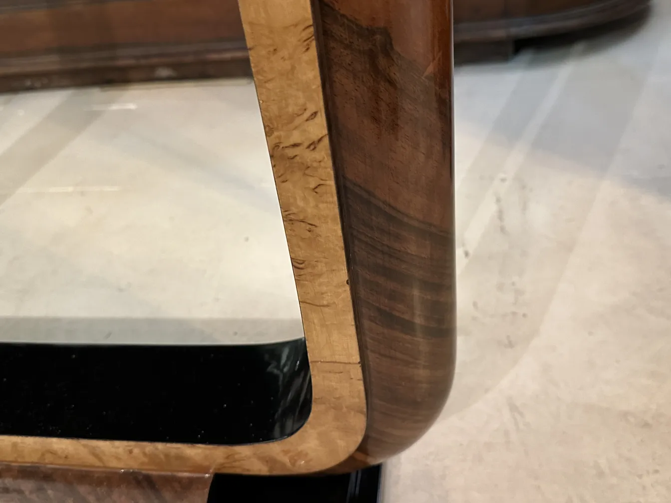 Details of an antique console furniture with rounded corners, minimalist setting