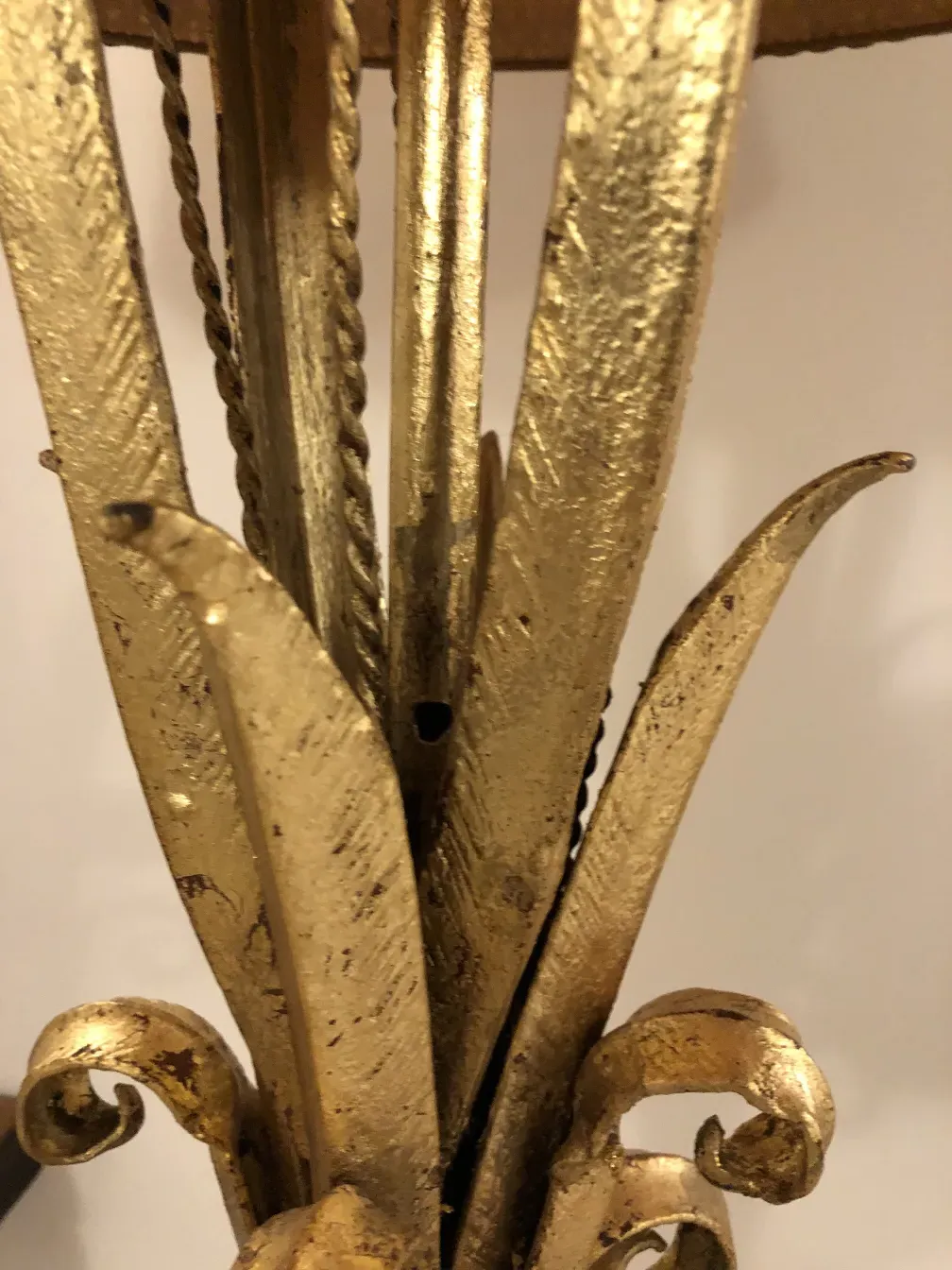 View of golden details on an antique decorative console.