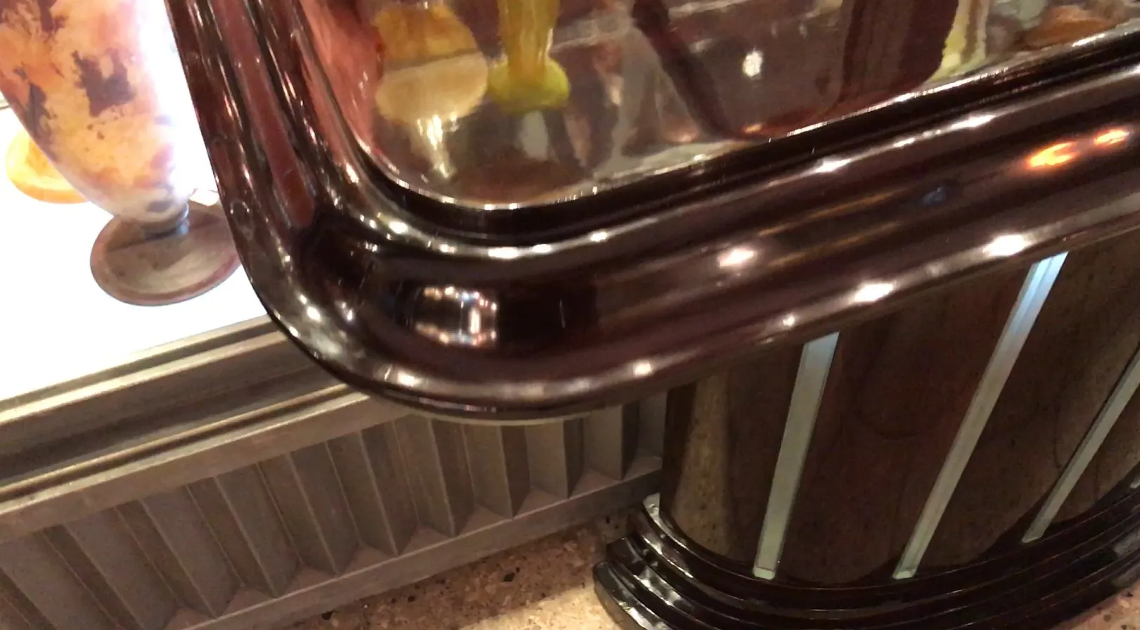 Antique console with a beautiful shiny finish in an elegant setting