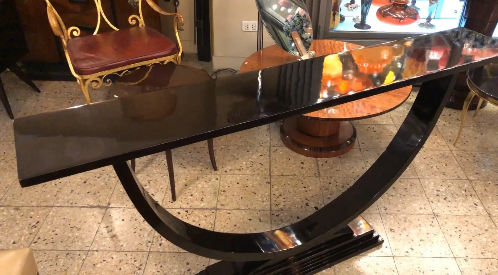 Elegant antique console with a sleek curved design