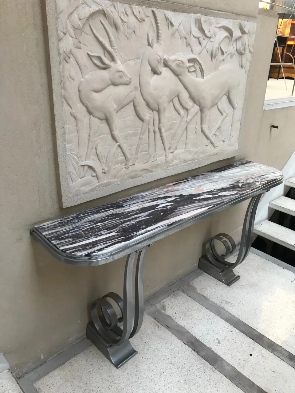 antique console table with elegant design and decorative background