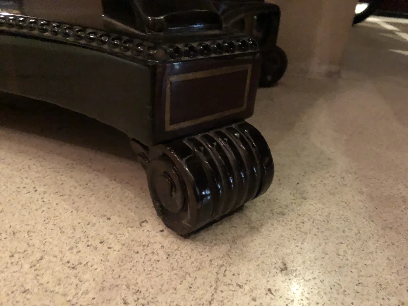 antique console base with wheels in the background