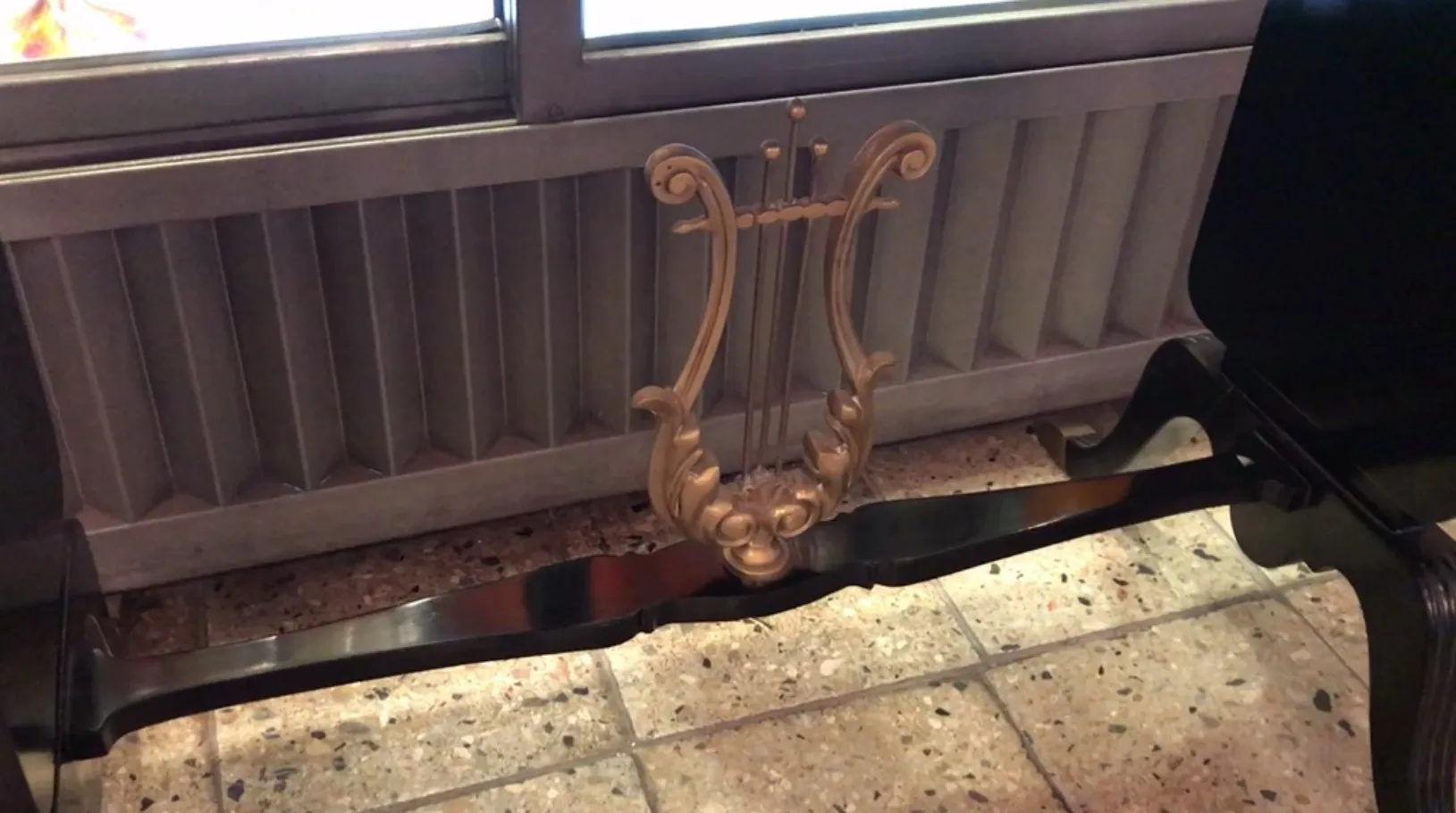 antique console with decorative design at the base