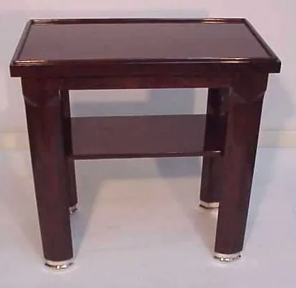 antique console with dark legs and lower shelf