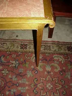 corner of an antique console with decorative design