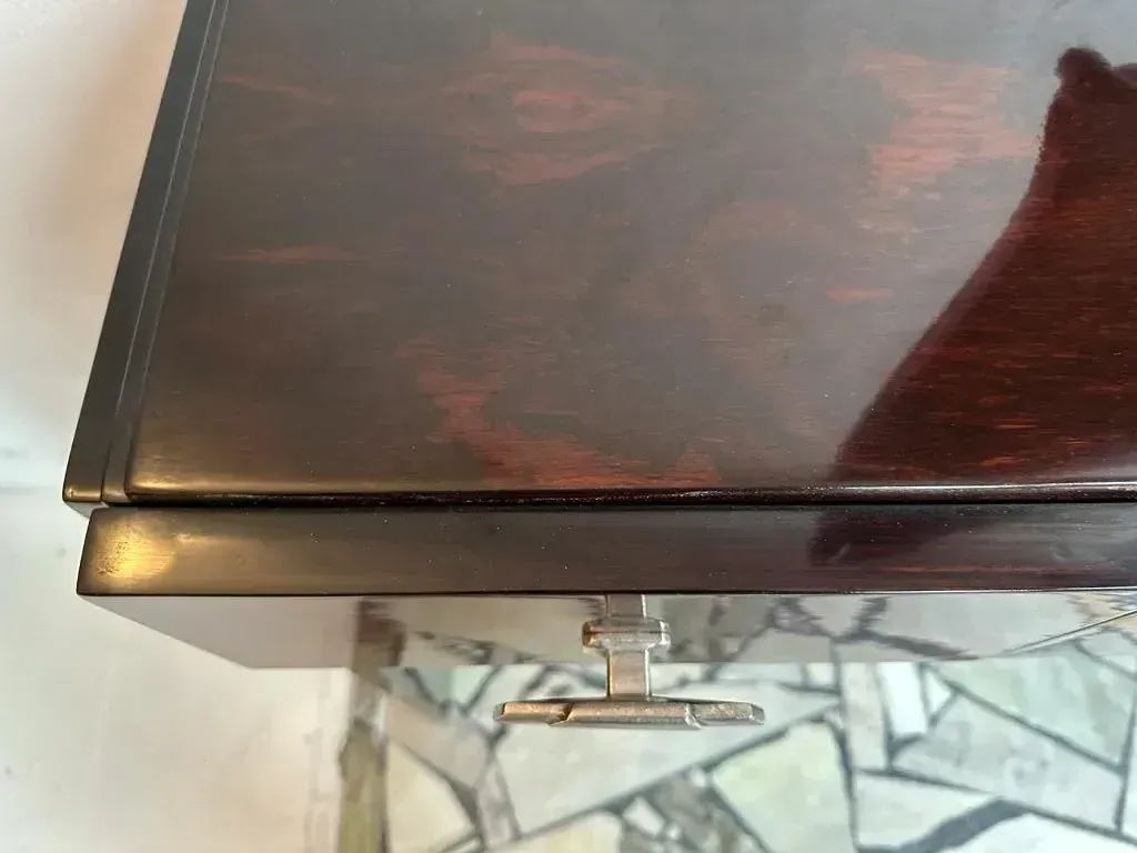 Side view of two antique consoles with decorative details