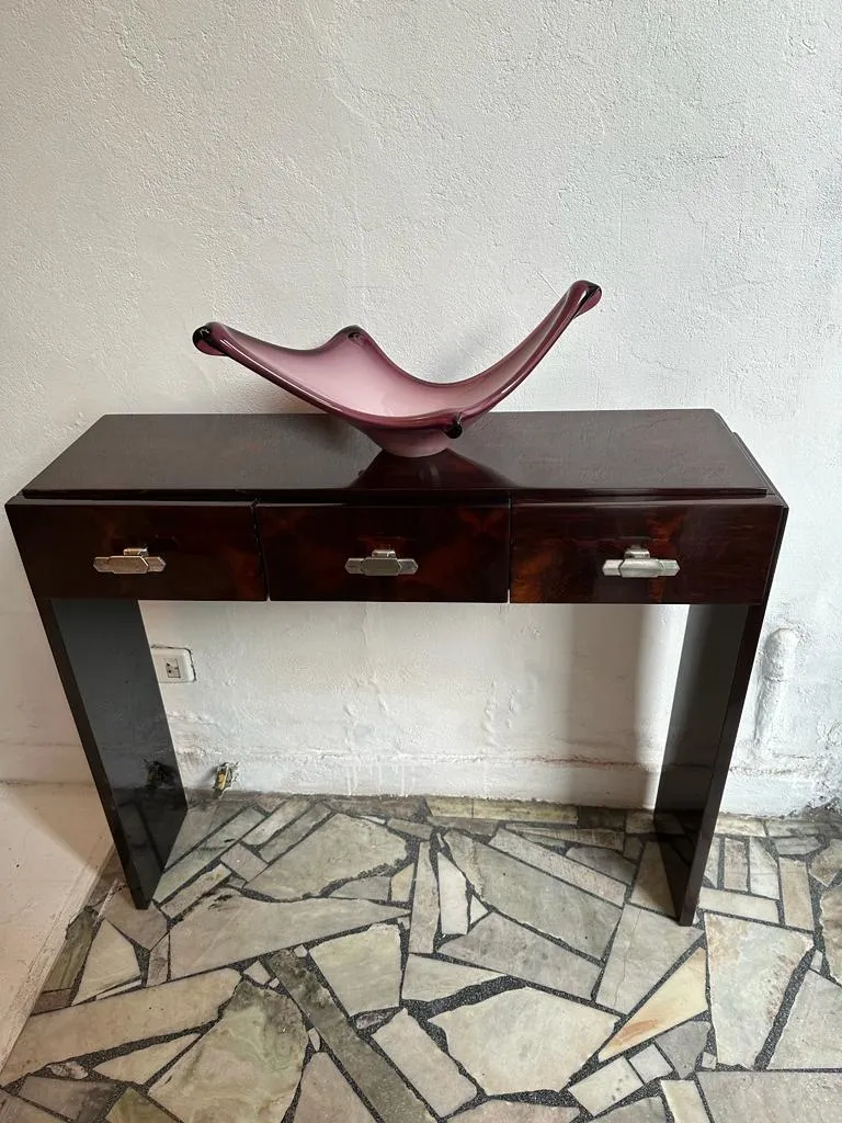 Two antique consoles with silver handles in neutral setting