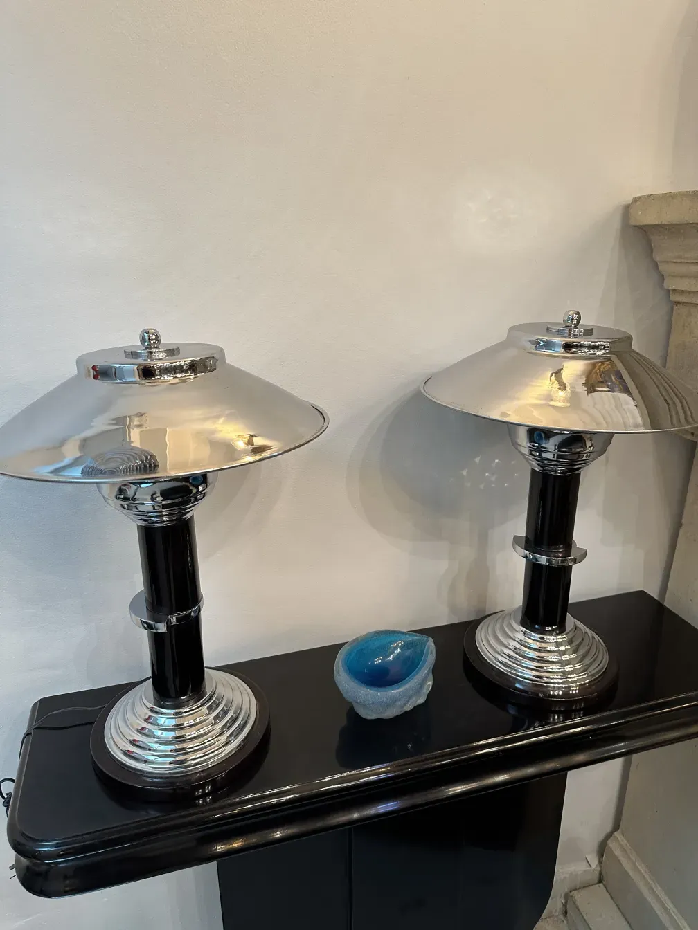 two antique consoles with decorative features