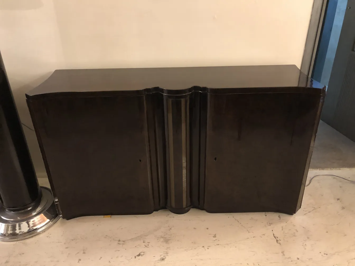 Front view of two antique consoles, elegant and classic in a neutral setting.