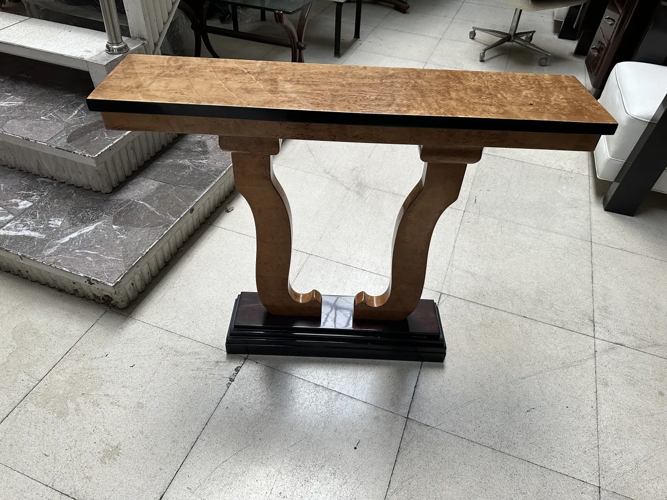 two antique consoles in a stylish modern setting