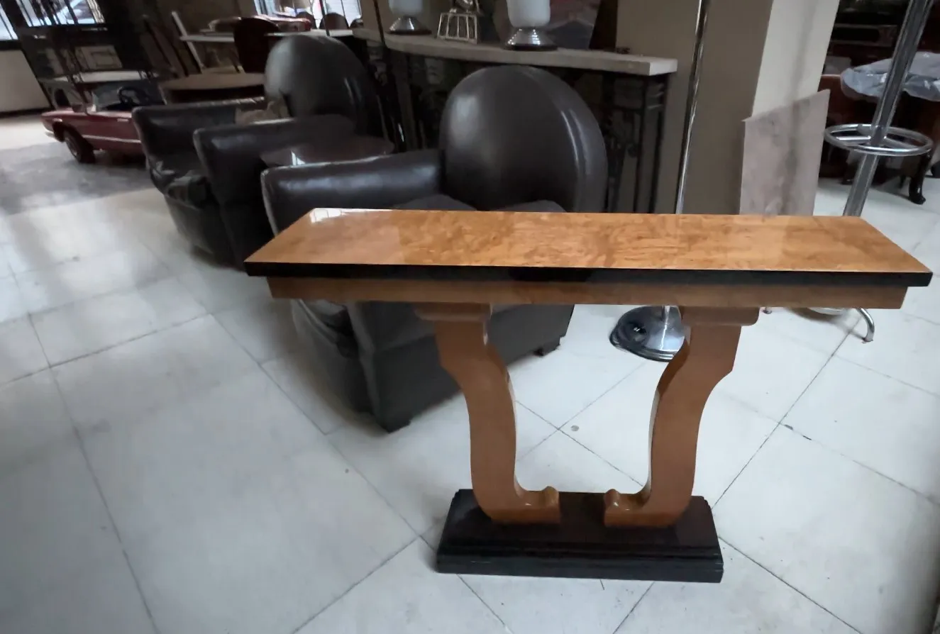 Two decorative antique consoles in a neutral setting