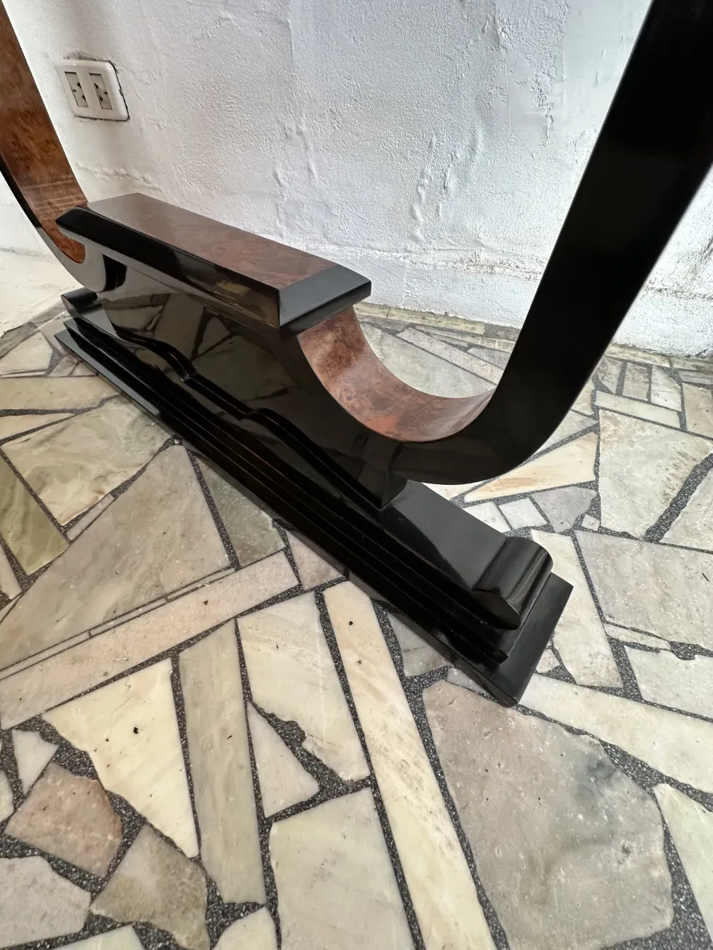 Three antique consoles in a decorative setting