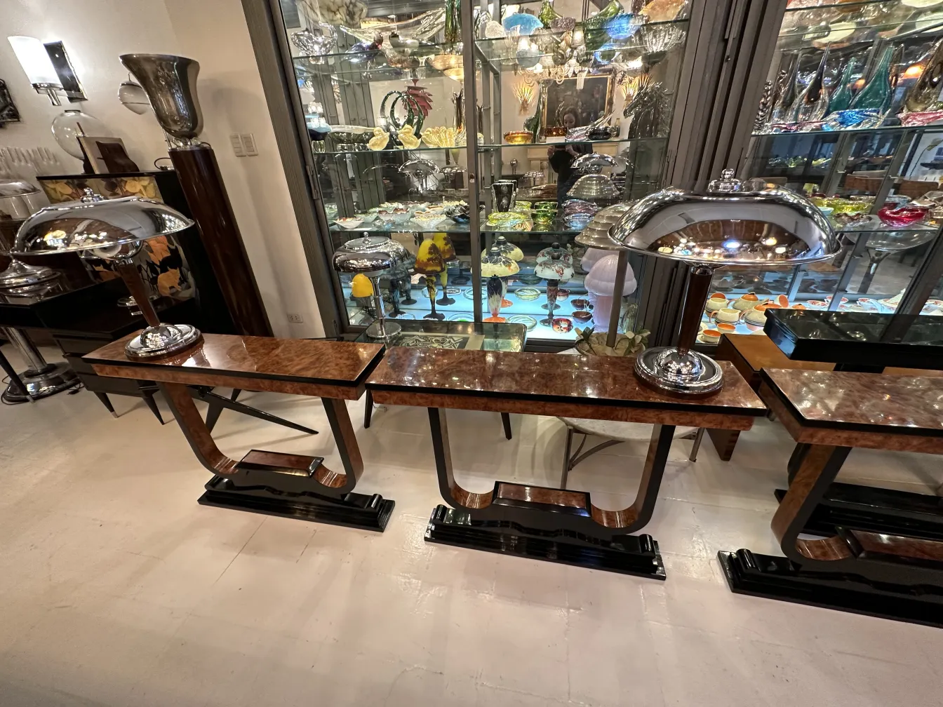 three antique consoles in a vintage setting